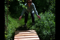 Nancy Gable celebrates the new bridge in Mill Pond Park